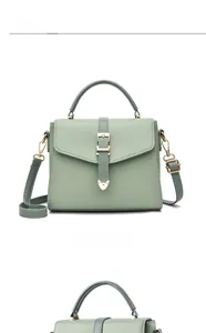 Détail du sac en cuir PU vert sauge avec fermoir cœur doré et poignée élégante