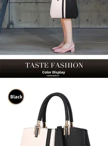 Detail of color-block tote bag handle with black litchi texture and gold hardware