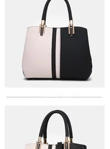 Close-up of color-block tote bag with dual handles, lychee texture, and gold hardware