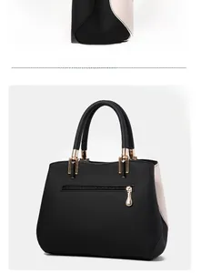 Detail of color-block tote bag with pebble leather texture and functional back zipper