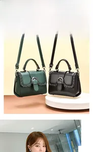 Detail of dark green and black flap handbags with metal chain trim and adjustable straps