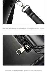 Detail view of electroplated metal clasp and smooth zipper on black leather shoulder bag