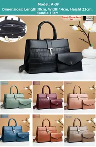 Detail view of croco-embossed tote bag set with metal T-clasp and size dimensions