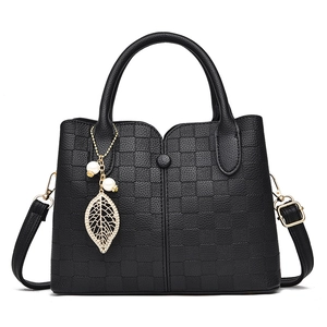 Black checkered tote bag with leaf pendant and adjustable strap for women