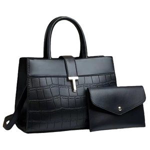 Black faux leather tote bag and pouch set with crocodile texture and gold T-buckle