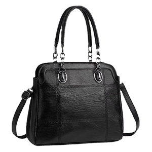 Black pebbled leather tote bag with cross-stitch detail and metal chain strap