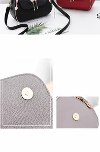 Close-up of shiny metal magnetic buckle and pebble leather texture on a stylish handbag