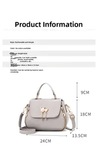 Grey pebbled leather handbag detail showing dimensions 24x18x13.5cm and cat pearl charm