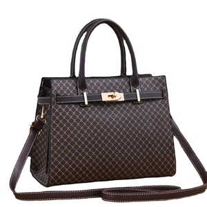Structured brown tote bag with lattice pattern and gold twist lock in perspective view