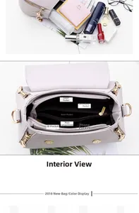 Detail view of the interior layout with six functional pockets in a light gray shoulder bag