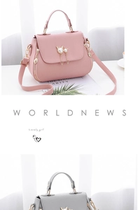 Detail of pink and grey crossbody bags featuring cat metal buckles and pearl charms