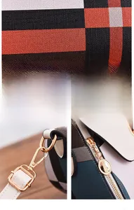Detail view of plaid patterned synthetic leather with high-quality metal hardware hooks
