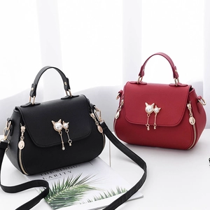 Chic women's lychee leather handbag in black and red with pearl cat ear charm decoration