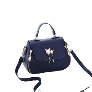 Dark blue litchi pattern handbag with cute pearl cat charms and gold hardware