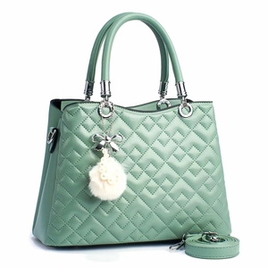 Elegant mint green quilted handbag with silver hardware and decorative pearl charm
