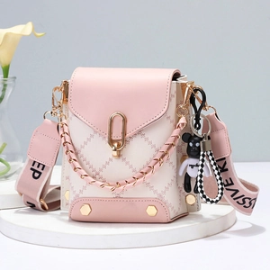 Pink and white patchwork mini crossbody bag with rhombus stitching and bear charm
