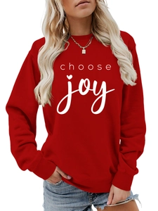 Close-up of choose joy lettering and ribbed neckline on a red cotton sweatshirt