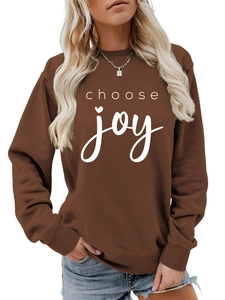 Detail view of the Choose Joy lettering and heart design on this brown crewneck sweatshirt