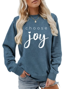 Detail of white 'choose joy' lettering and heart on a navy crewneck sweatshirt