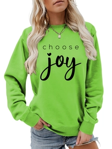 Detail of ribbed crew neck and black choose joy script on lime green sweatshirt