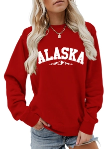 Detail of red Alaska graphic sweatshirt featuring ribbed cuffs and soft fabric texture
