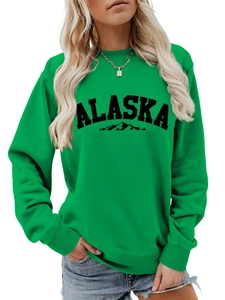 Detail of green Alaska sweatshirt featuring high-quality fabric texture and graphic print
