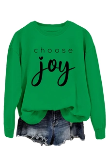 Detail of Choose Joy printed slogan on a vibrant green crewneck casual sweatshirt