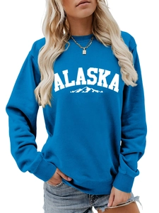 Detail of blue ALASKA sweatshirt showing mountain graphic and comfortable round neck fit