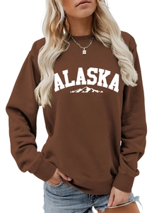 Detail view of coffee-colored crewneck sweatshirt with Alaska mountain print for women