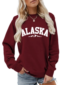 Detail of burgundy Alaska print sweatshirt showing round neck and soft cotton texture