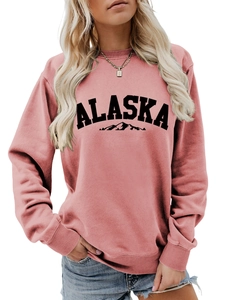Detail of round neck sweater with Alaska print and mountain silhouette in dusty rose
