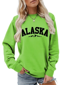 Detail of Alaska letter print and mountain outline on neon green crewneck sweatshirt