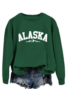 Detail of green Alaska sweatshirt featuring high-quality white letter print and mountain logo