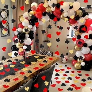 Las Vegas casino party decorations with poker balloons and card suit paper confetti
