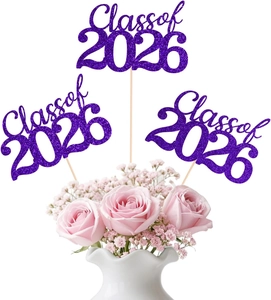 Purple glitter Class of 2026 cake toppers used as decorative picks in a floral bouquet
