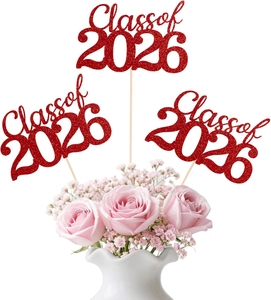Glittering red Class of 2026 cake toppers with decorative floral background