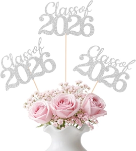 Silver glitter Class of 2026 cake toppers placed in pink roses for graduation decor