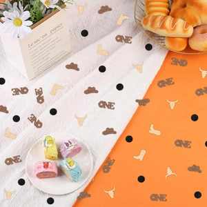Cowboy themed first birthday party confetti with gold and brown glitter shapes