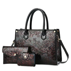 Luxury 3-piece tote bag set with red floral embossing and glossy black patent leather