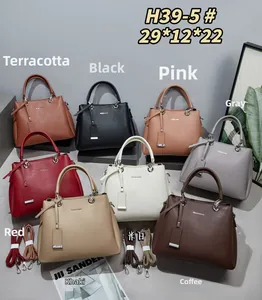 Top view of luxury pebbled leather handbags displayed in eight assorted fashion colors