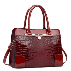 Deep red crocodile embossed leather tote bag with gold hardware and top handles