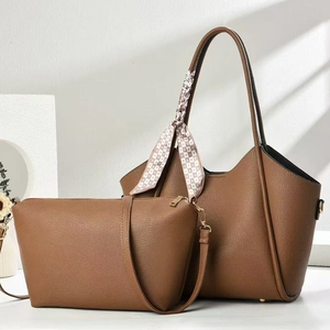 Brown leather tote bag set with matching small pouch and stylish patterned scarf handle
