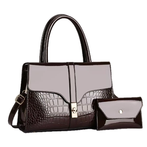 Dark brown patent leather handbag set with crocodile pattern and golden buckle