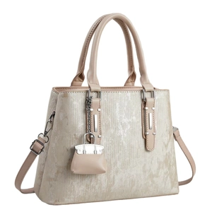Fashionable beige brushed texture handbag with top handles and a mini bag charm