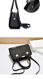 Detail of crocodile-embossed leather, magnetic clasp, and gold hardware on a black handbag