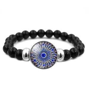 Turkish evil eye beaded bracelet with polished black beads and blue mandala charm