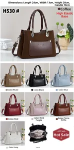 Vue détaillée des sacs à main bicolores avec structure interne et huit coloris variés