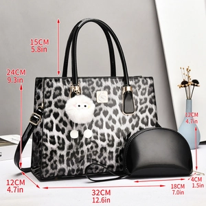 Large leopard print tote bag with black handles, furry charm, and size measurements