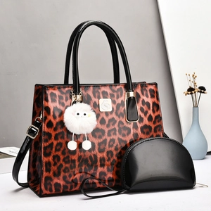 Luxury leopard print large tote bag and black patent leather pouch with gold swan logo