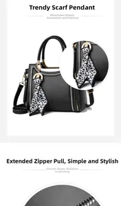 Detail view of black lychee grain leather handbag with leopard scarf and metal zipper